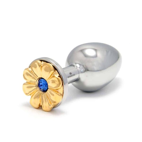 ROSEBUDS en Brigade Mondaine Daisy Blue Gold Plug en acero quirúrgico con patrón de flores doradas y cristal azul