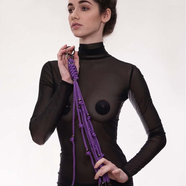 Figure of A large, purple whip with waxed cotton strings and stainless steel silver beads. The product features eight strands and a snap hook that can be attached to a necklace or bag.