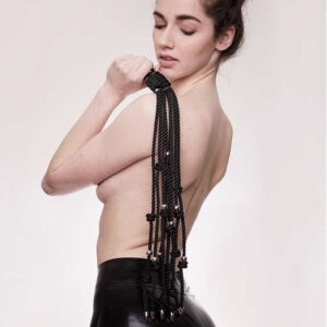 Figure of A brand large black whip with waxed cotton strings and stainless steel silver beads. The product features eight strands and a snap hook that can be attached to a necklace or bag.