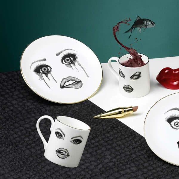 Lauren Dickinson Clarke tableware by Moody Muse Tableware set with emotional faces made up between shock, passion, sadness and anger