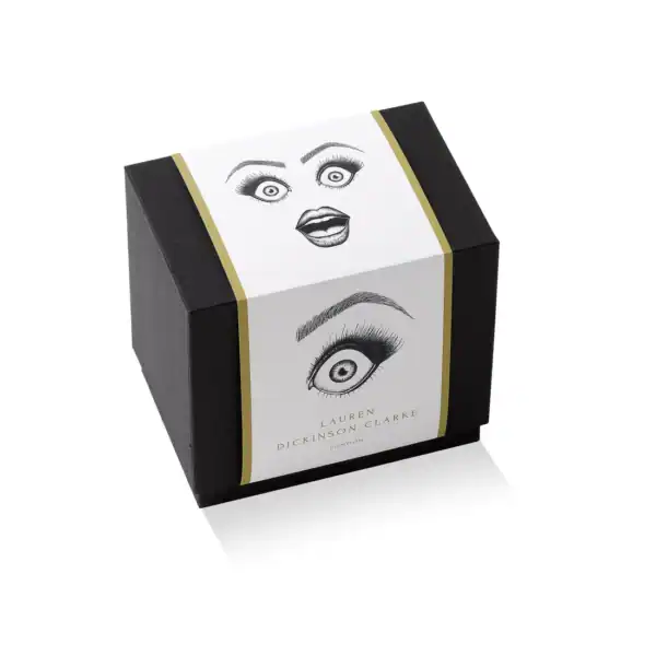 LDC - Performer Tasse à café Emballage conçu pour les mugs, de couleur noire, orné d'illustrations d'yeux et d'une finition dorée élégante.