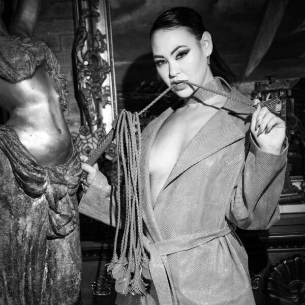 HOUSE OF SXN Rosa Sanguine whip, red patent leather, twelve braided straps, leather rose, luxury BDSM, handcrafted in Palm Beach, refined and sophisticated pleasure.