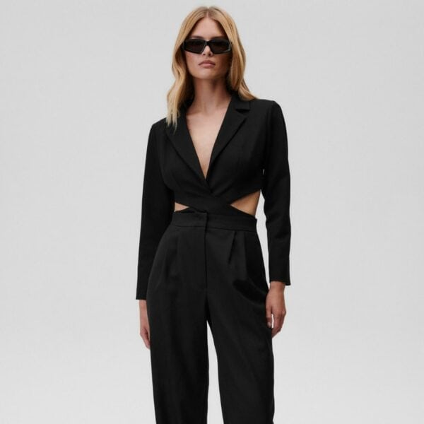 UNDRESS CODE - Body Obsessed Mannequin portant le body Obsessed de Undress Code sur un fond blanc, avec un pantalon noir.