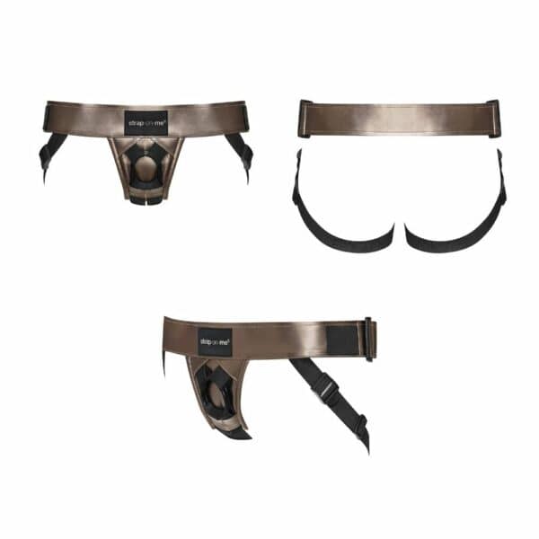 STRAP-ON-ME - Curious Bronze Harness Curious harness in metallic bronze imitation leather, adjustable and ergonomic, with double silicone ring for dildo. Elegant, sensual design for optimum comfort and support.