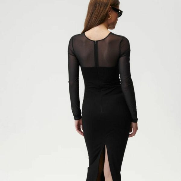UNDRESS CODE - Sleek Silhouette Dress Detail of a Photo of a Backless Woman Wearing a Black Long Sleeve Dress with Fishnet and Viscose Panels