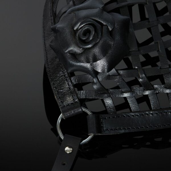 Detail of the Rose on the Front Packshot of a Mask in Leather Straps and Rose in Black Leather