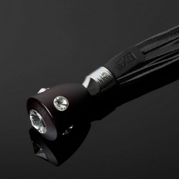 Detail on the Packshot Handle of a Swift with Black Leather Straps and Crystal Handle