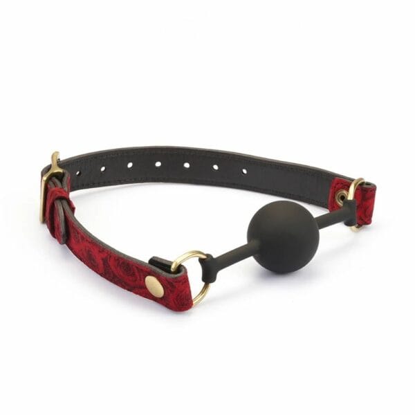 Gag BDSM Kinbaku Ukiyo-e avec touches dorées, conçu en silicone alimentaire pour un confort optimal. Sangles ajustables, lavable et imperméable. Fusion de style et de fonctionnalité pour une expérience unique.
