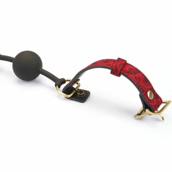Gag BDSM Kinbaku Ukiyo-e avec touches dorées, conçu en silicone alimentaire pour un confort optimal. Sangles ajustables, lavable et imperméable. Fusion de style et de fonctionnalité pour une expérience unique.