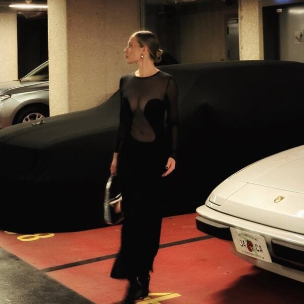 UNDRESS CODE - BRIGADE MONDAINE LINGERIE - Sleek Silhouette dress in black Detail of a Photo of a Front Woman Wearing a Black Long Sleeve Dress with Fishnet and Viscose Panels