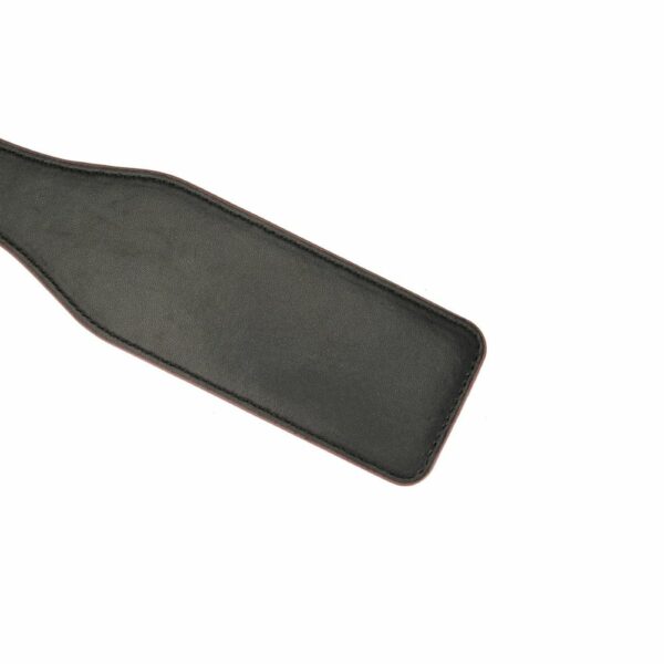 Detail of Red Leather Paddle Packshot on Black Leather Face