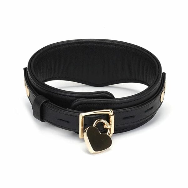 Dark Secret slave collar in black leather with gold chain leash. Adjustable with metal buckles and compatible with various BDSM accessories. Designed for sophisticated domination games.