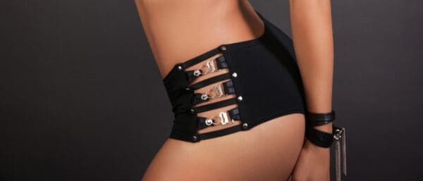LALITA - Corset Bodyshorts Woman wearing black shorty with metal buckles sold by Brigade Mondaine.