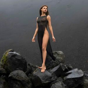 Long black stretch fishnet dress with fluid fall and high thigh slit