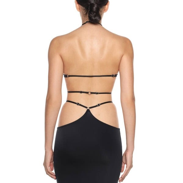 Long skirt in flowing, stretchy biflex by Anoeses, adorned with metal rings and featuring an adjustable high slit - a sensual, handcrafted creation.