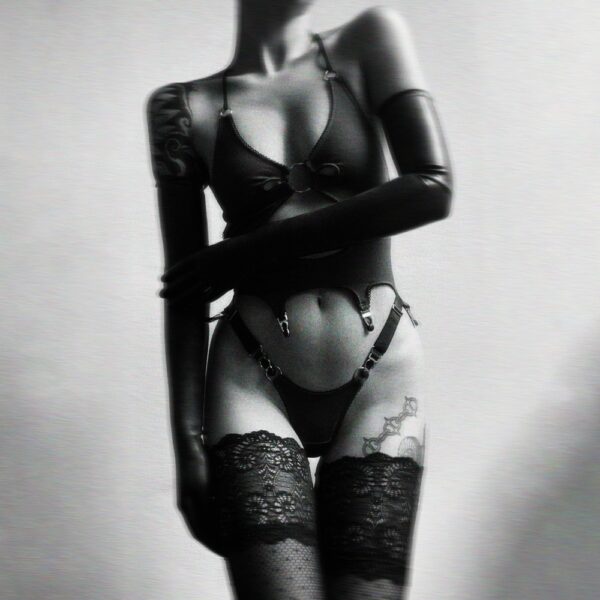 Mania bra in stretch cotton jersey with center cutout, garter ties, picot elastic, adjustable straps and silver hardware.