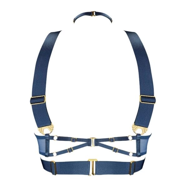 Ce modèle en édition saisonnière est décliné dans une teinte inédite : un bleu denim intense, contrasté par des finitions dorées à l’or 24 carats. L’anneau central et les multiples attaches métalliques renforcent la dimension bijou de cette création.