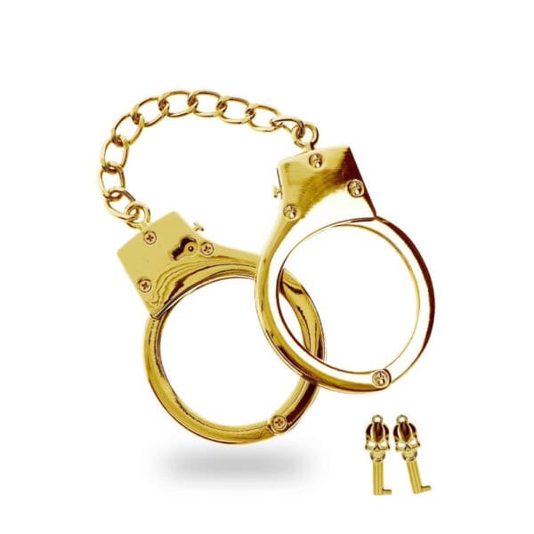 Goldene Handschellen aus Metall mit zentraler Kette und Schlüsseln inklusive, glänzendes Finish, angeboten von Brigade Mondaine Paris.