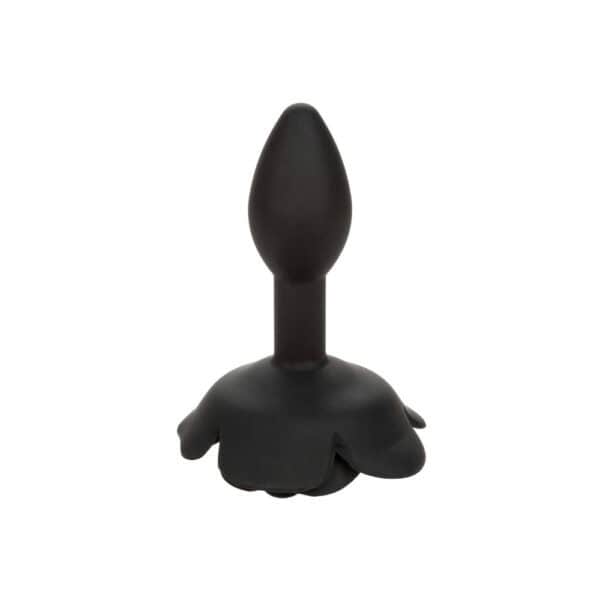 Plug anal noir en silicone mat, tête sculptée en forme de rose avec base évasée, présenté par Brigade Mondaine Paris.