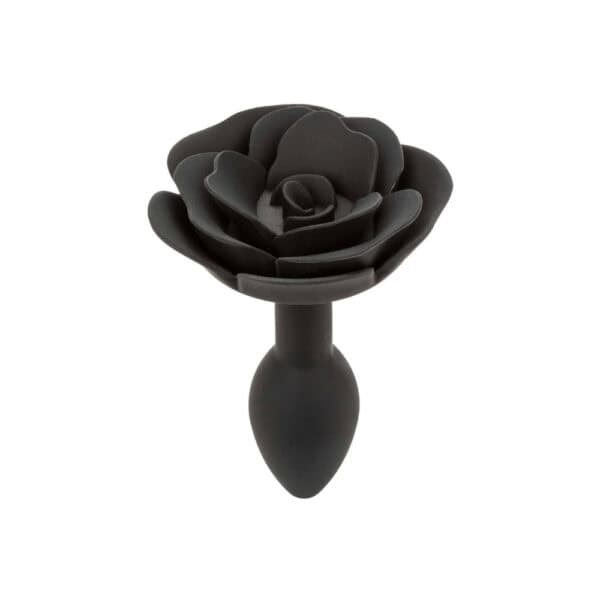 Plug anal noir en silicone mat, tête sculptée en forme de rose avec base évasée, présenté par Brigade Mondaine Paris.