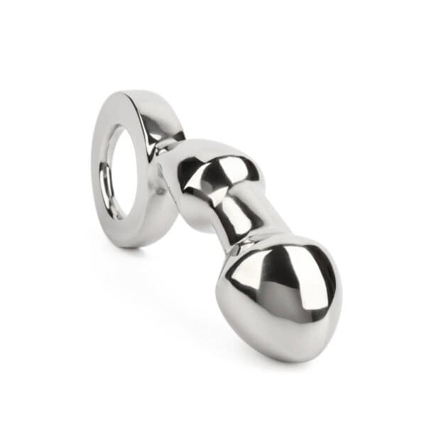 Plug anal DRANG en acier inoxydable poli avec base circulaire ergonomique, finition miroir, sélectionné par Brigade Mondaine Paris.