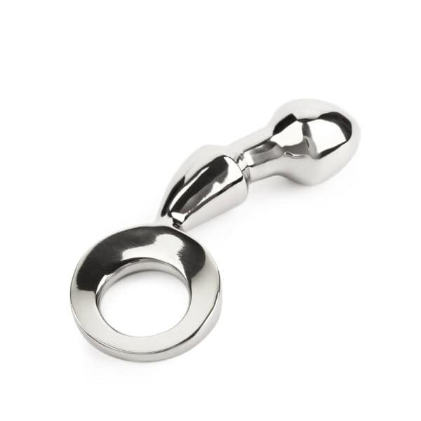 Plug anal DRANG en acier inoxydable poli avec base circulaire ergonomique, finition miroir, sélectionné par Brigade Mondaine Paris.