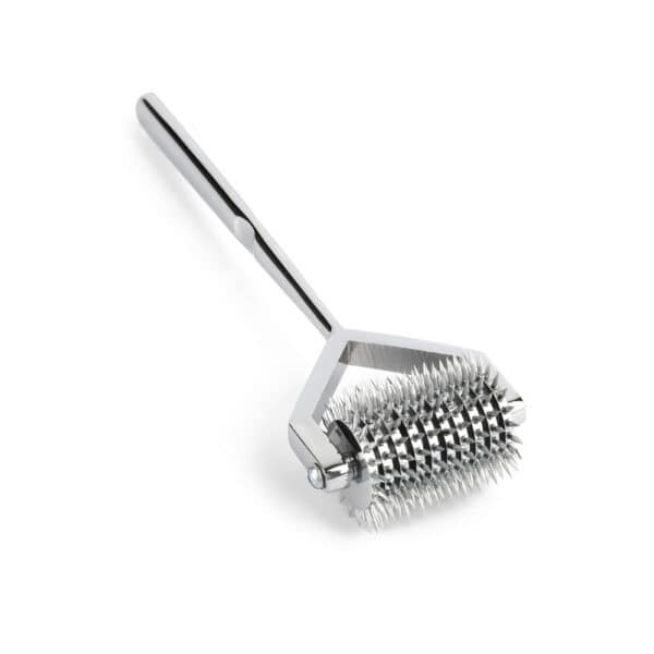Wartenberg castor in bright stainless steel with serrated wheels, medical design revisited, presented by Brigade Mondaine Paris on light background.