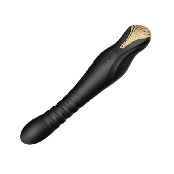 Schwarzer Stimulator aus strukturiertem Silikon mit goldenem Finish, vertikal auf dunklem Hintergrund dargestellt, angeboten von Brigade Mondaine Paris.