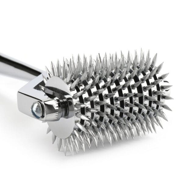 Wartenberg castor in bright stainless steel with serrated wheels, medical design revisited, presented by Brigade Mondaine Paris on light background.