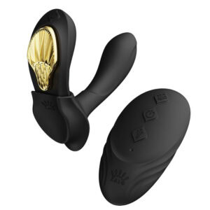 Portable vibrator in black with gold details, ergonomic design and integrated controls, presented on a white background, selection Brigade Mondaine Paris.