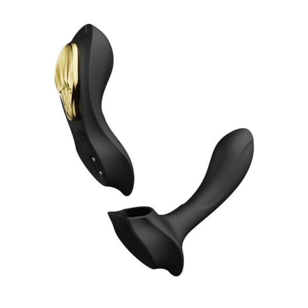 Vibromasseur portable de couleur noire avec détails dorés, design ergonomique et commandes intégrées, présenté sur fond blanc, sélection Brigade Mondaine Paris.