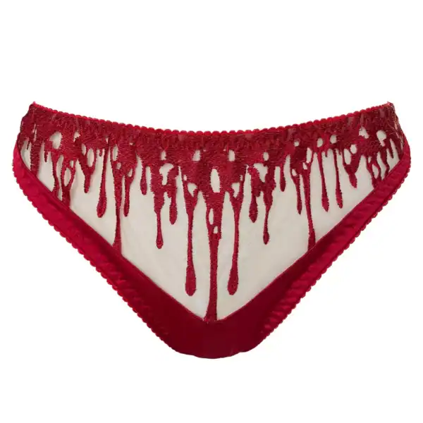 String CRIMSON VIDE NOIR Brigade Mondaine Paris String CRIMSON VIDE NOIR présenté chez Brigade Mondaine Paris, string rouge en tulle transparent brodé de motifs gouttes stylisées, finitions délicates et coupe épurée.