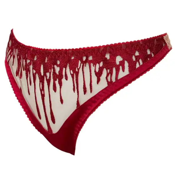 String CRIMSON VIDE NOIR Brigade Mondaine Paris String CRIMSON VIDE NOIR présenté chez Brigade Mondaine Paris, string rouge en tulle transparent brodé de motifs gouttes stylisées, finitions délicates et coupe épurée.