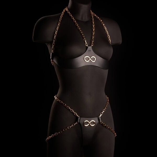 ARIA IINFYNII open knickers in black leather with gold chains and infinity symbol, graphic and structured piece, selection Brigade Mondaine Paris