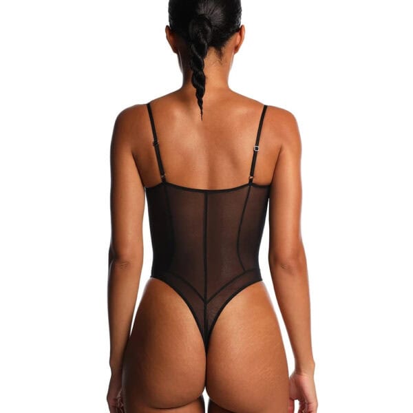 ANOESES black tulle bodysuit worn by an elongated female model, side cut-outs, decorative laces on bust, worn with black stockings and matching collar, high-end fetish aesthetic Brigade Mondaine Paris.