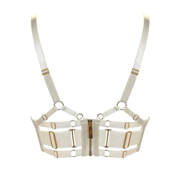 BORDELLE – Signature Cream chez Brigade Mondaine Paris Soutien-gorge BORDELLE Signature Cream vu de face, en tulle transparent ivoire avec bandes elastiques structurantes et finitions métalliques dorées, présenté chez Brigade Mondaine Paris.