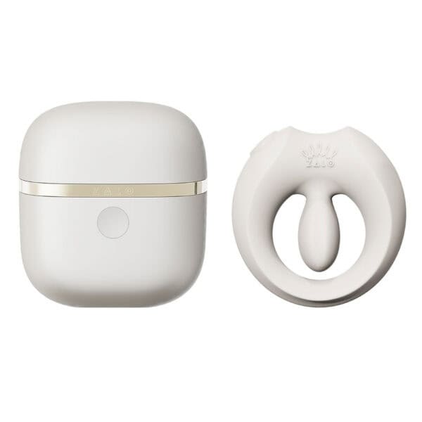 APIS connected cockring presented with its charging case, USB cable and warranty card, set against a light background in a minimalist, elegant setting.