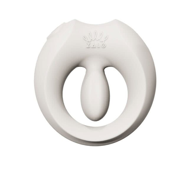 APIS connected cockring presented with its charging case, USB cable and warranty card, set against a light background in a minimalist, elegant setting.