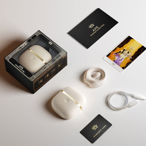 APIS connected cockring presented with its charging case, USB cable and warranty card, set against a light background in a minimalist, elegant setting.