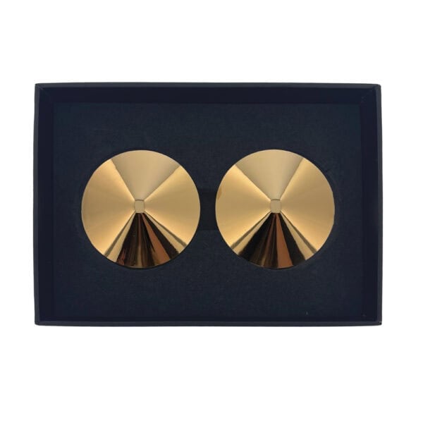 Seduction gold nipple covers glossy finish | Brigade Mondaine A pair of Seduction teat covers in gilded metal with a circular surface and high-gloss finish, presented on a white background in a neat, minimalist aesthetic.