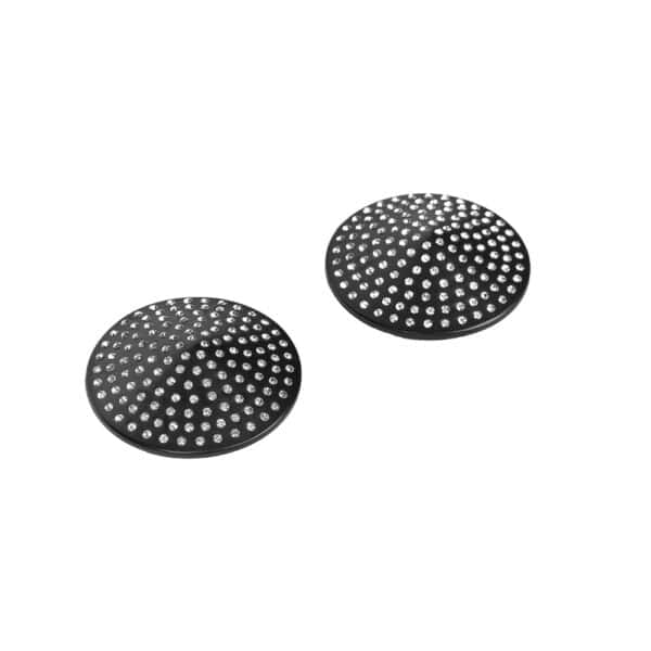 A pair of circular black nipple covers adorned with sparkling rhinestones, presented in a black case on a white background, with an elegant, minimalist aesthetic.