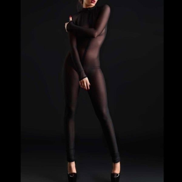 Model wearing the CATANZARO black mesh Sweety catsuit at Brigade Mondaine Paris, featuring a close-fitting full cut, long sleeves, uniform transparency and minimalist finish.