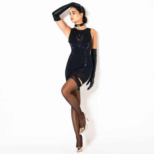 Model wearing black Whitney dress with CATANZARO harness at Brigade Mondaine Paris, slim fit, graphic details, long gloves and matching necklace, photographed in studio.