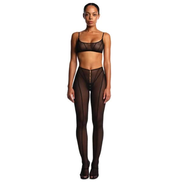 Ensemble ANOESES en mesh noir composé d’un soutien-gorge et d’un pantalon transparent à lignes verticales, porté par un mannequin sur fond blanc.
