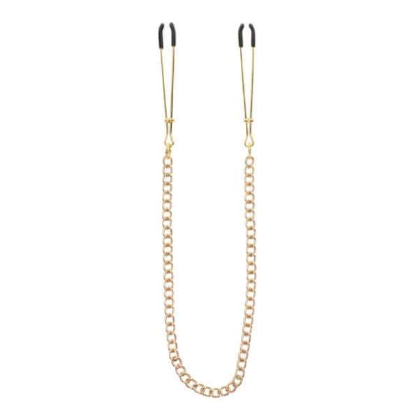 Model wearing gold-plated metal nipple clamps connected by a thin chain, photographed against a solid colored background with the framing centered on the bust.