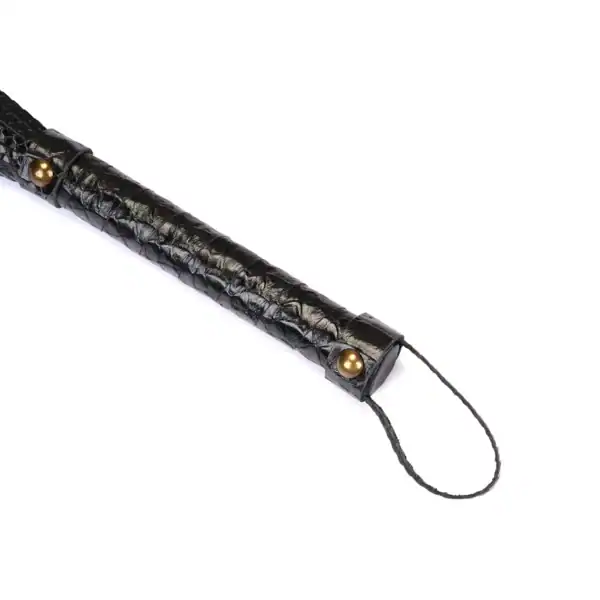 LIEBE SEELE black crocodile-embossed leather whip with sheathed handle, shown on white background