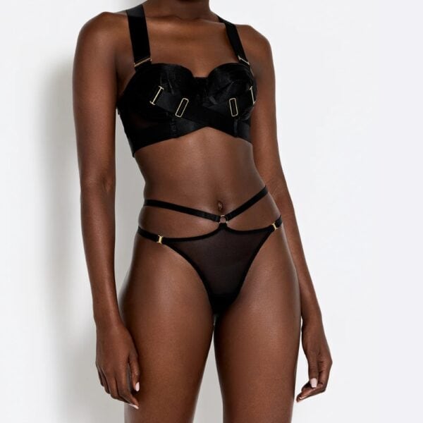 BORDELLE Elastischer Slip Schwarz Schwarzer elastischer Slip BORDELLE mit transparentem Tüll, verstellbaren Riemen und goldenen Metallbeschlägen.