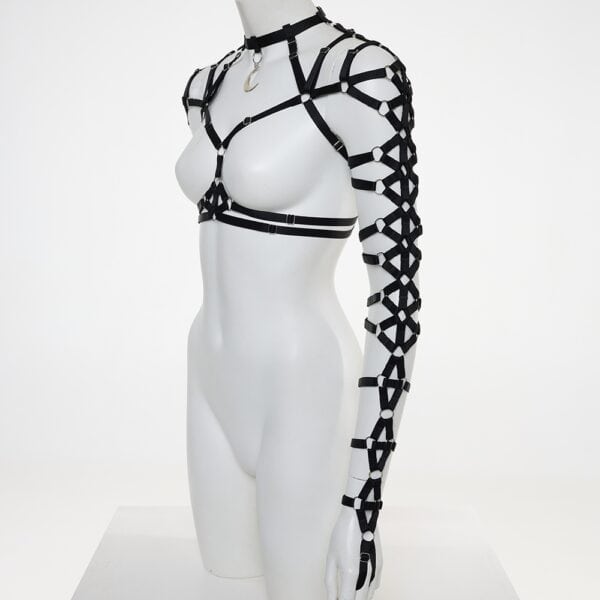Moon Warrior FLASH harness in black tulle and geometric straps, worn by a model, three-quarter view, details of strapped sleeves and bust cut-outs - Brigade Mondaine Paris
