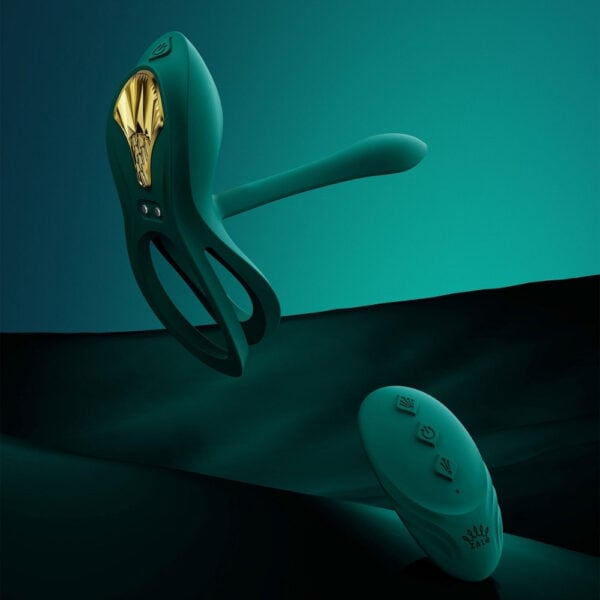 Portable vibrator with ergonomic design, presented with its box, set against a blue and red background, selection Brigade Mondaine Paris. Electric Sextoys