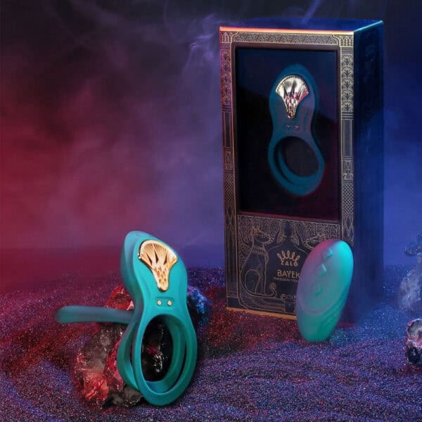 Portable vibrator with ergonomic design, presented with its box, set against a blue and red background, selection Brigade Mondaine Paris. Electric Sextoys